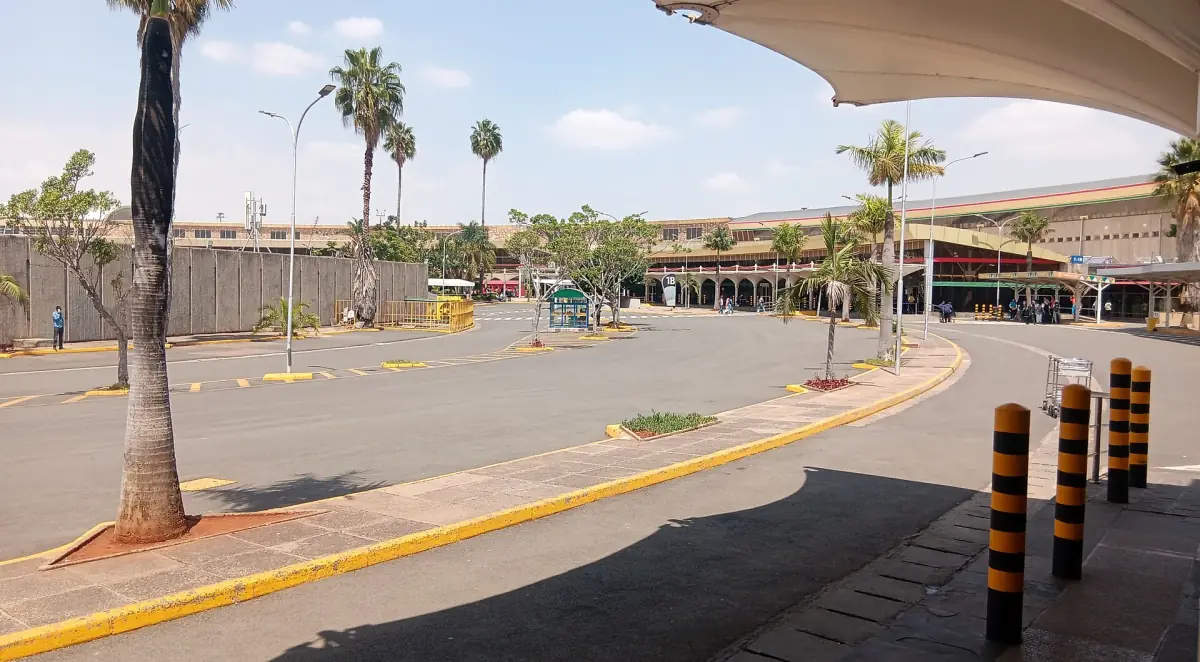 Forecourt and covered walkway at Jomo Kenyatta International Airport in daylight